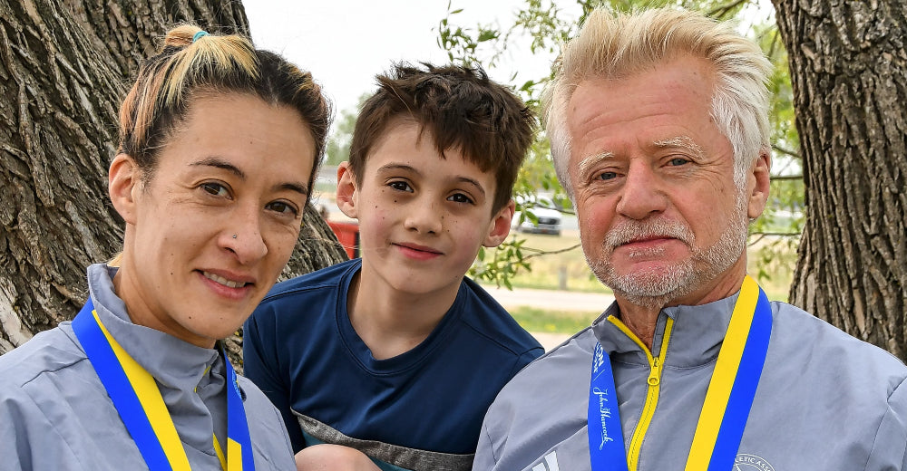 Amber Rollack (left), with son Beckett and dad Rod.