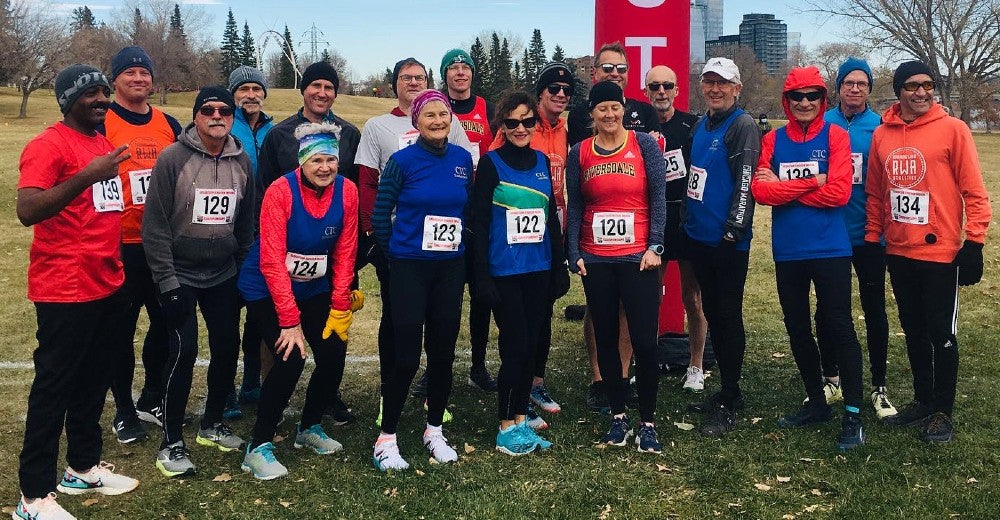 Masters runner socialize at the 2021 Saskatchewan Provincial Age Class Cross Country Championships. Signing up for a race is a great way to meet other runners.